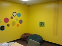 alt text = Yellow walls in room with bean bag chairs